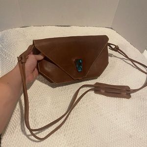 Vintage Bohemian leather crossbody handbag with large turquoise piece at snap